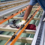 Tech-cleaning-conveyor Technician cleaning conveyor belt